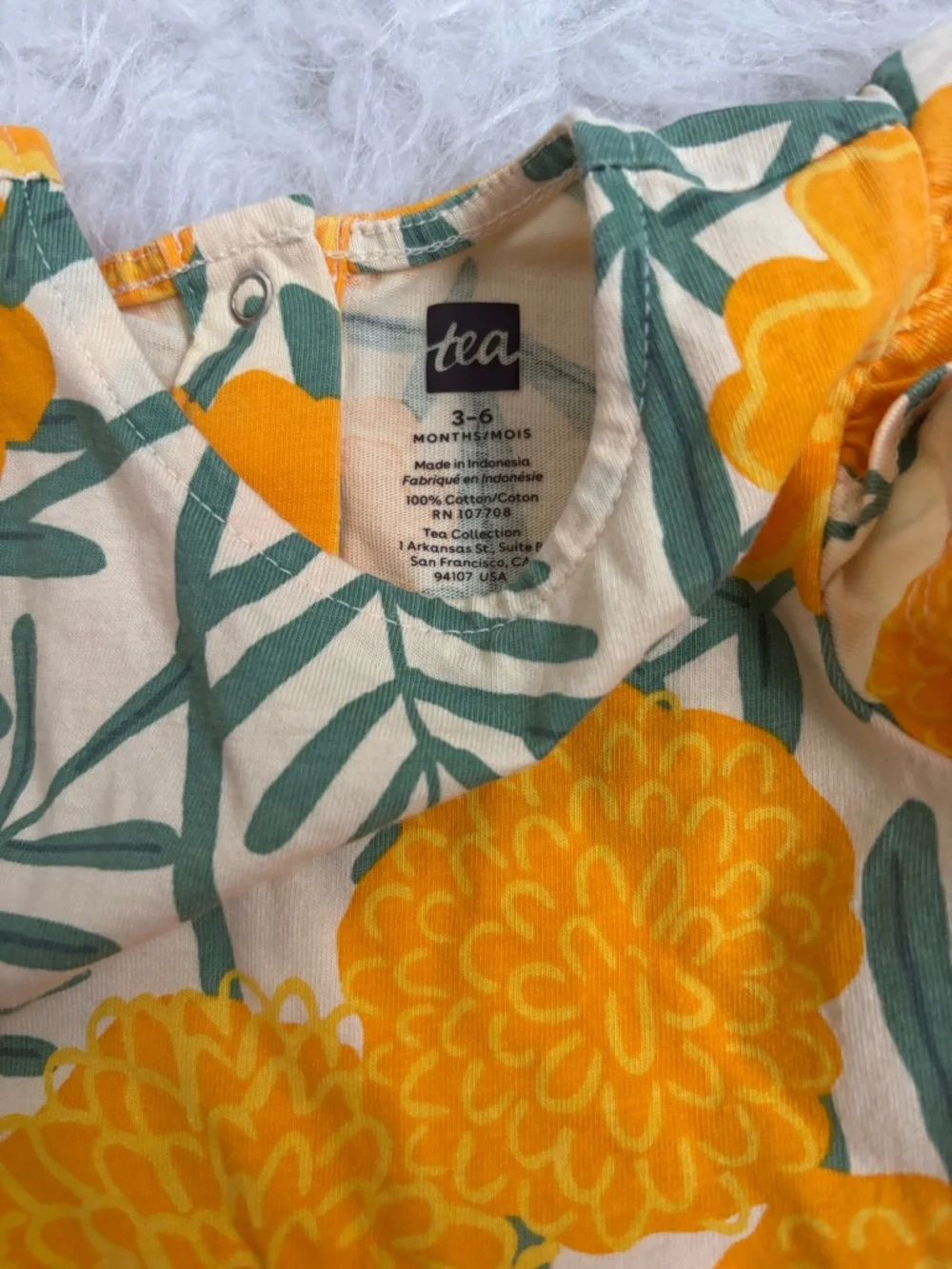 Tea Collection Baby Girl Romper with Mod Yellow Floral & Green Leaves AOP